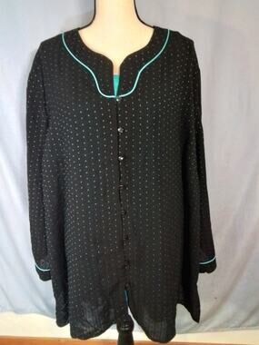 Maggie Barnes.  Turquoise tank top with black and Turquoise cover-up.